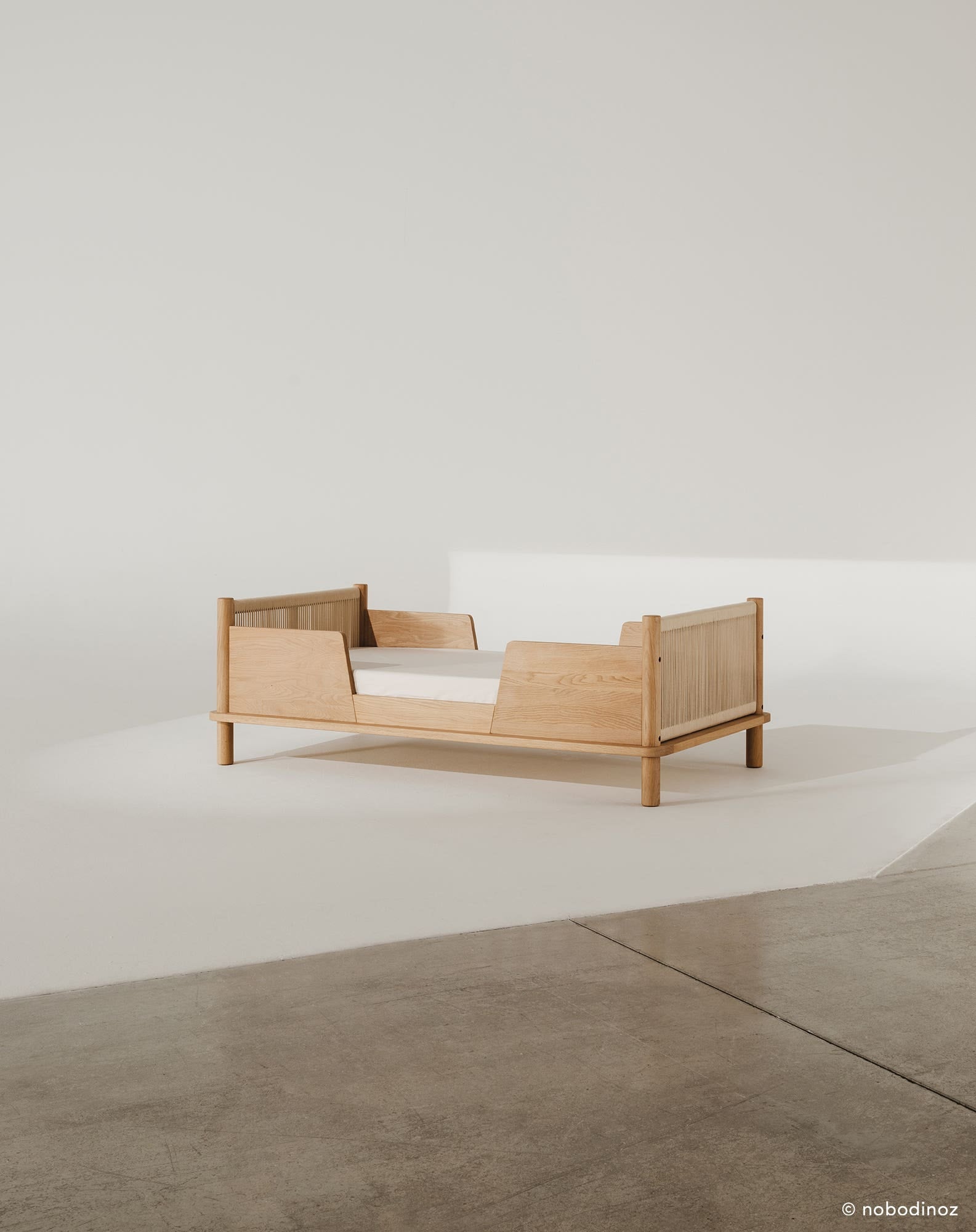 Nobodinoz Latitude junior bed with two safety rails